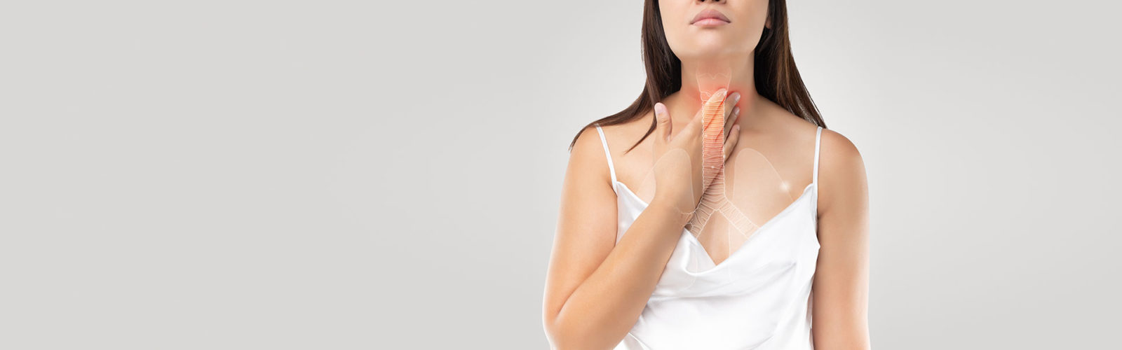 A woman grabs her esophagus - 